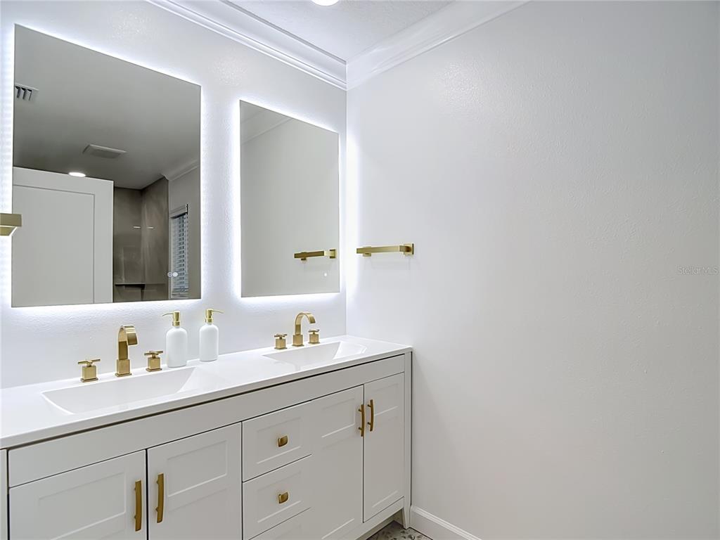 4536 Mitcher Road New Port Richey, FL 34652 - Photo 5 of 46 a bathroom with a sink and a mirror