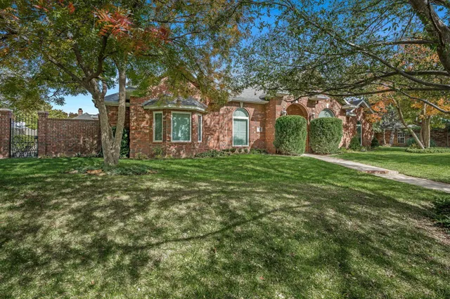front view of a house with a big yard