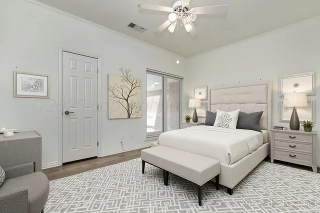 a bedroom with a large bed and a chandelier