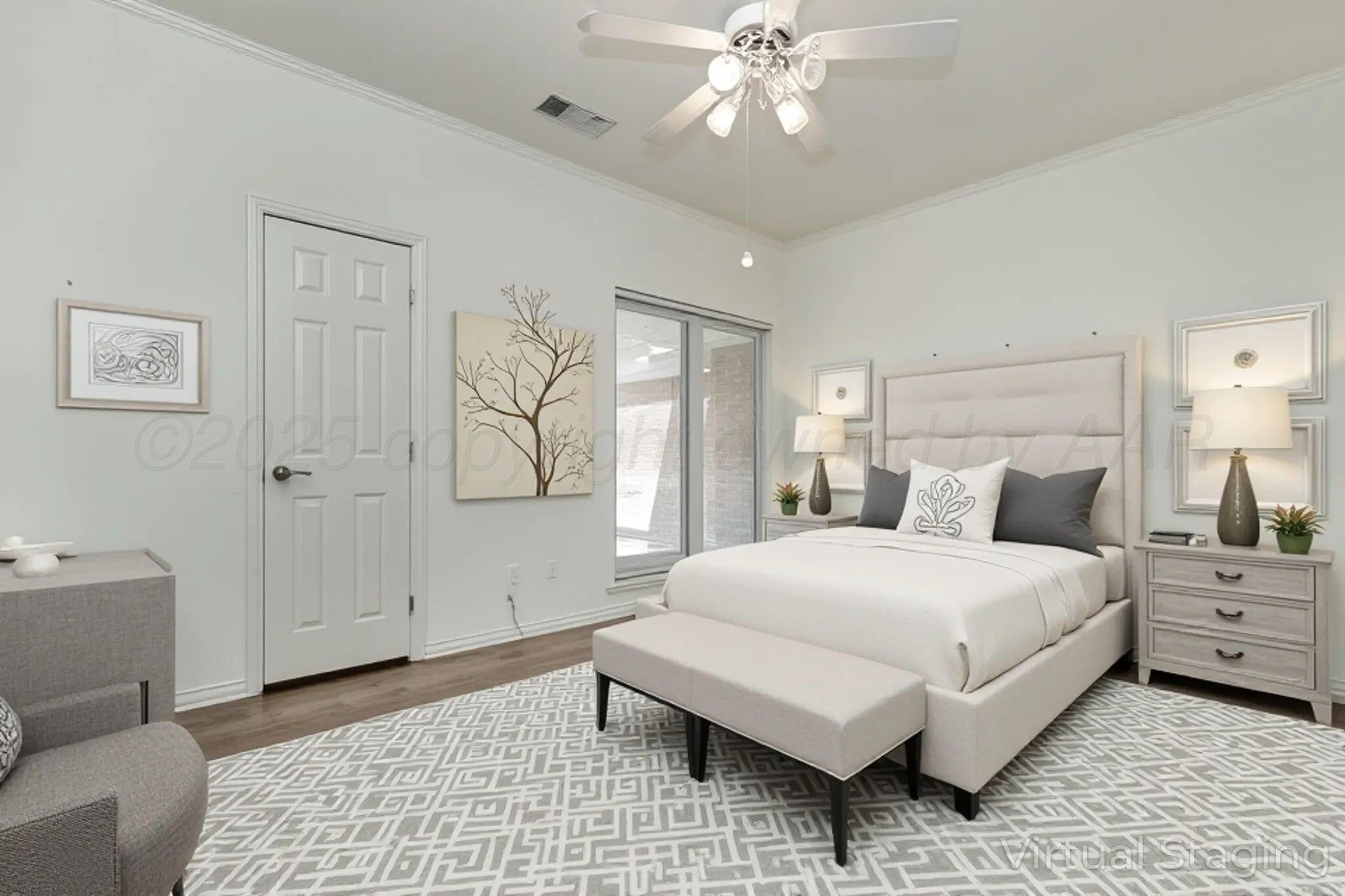 7408 Park Ridge Drive Amarillo, TX 79119 - Photo 31 of 51 a bedroom with a large bed and a chandelier