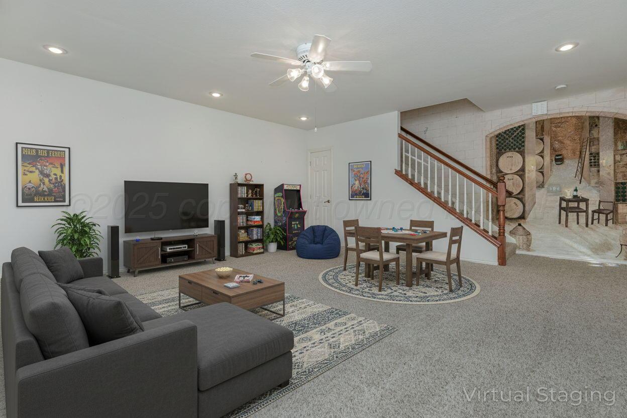 7408 Park Ridge Drive Amarillo, TX 79119 - Photo 40 of 51 a living room with furniture and a flat screen tv