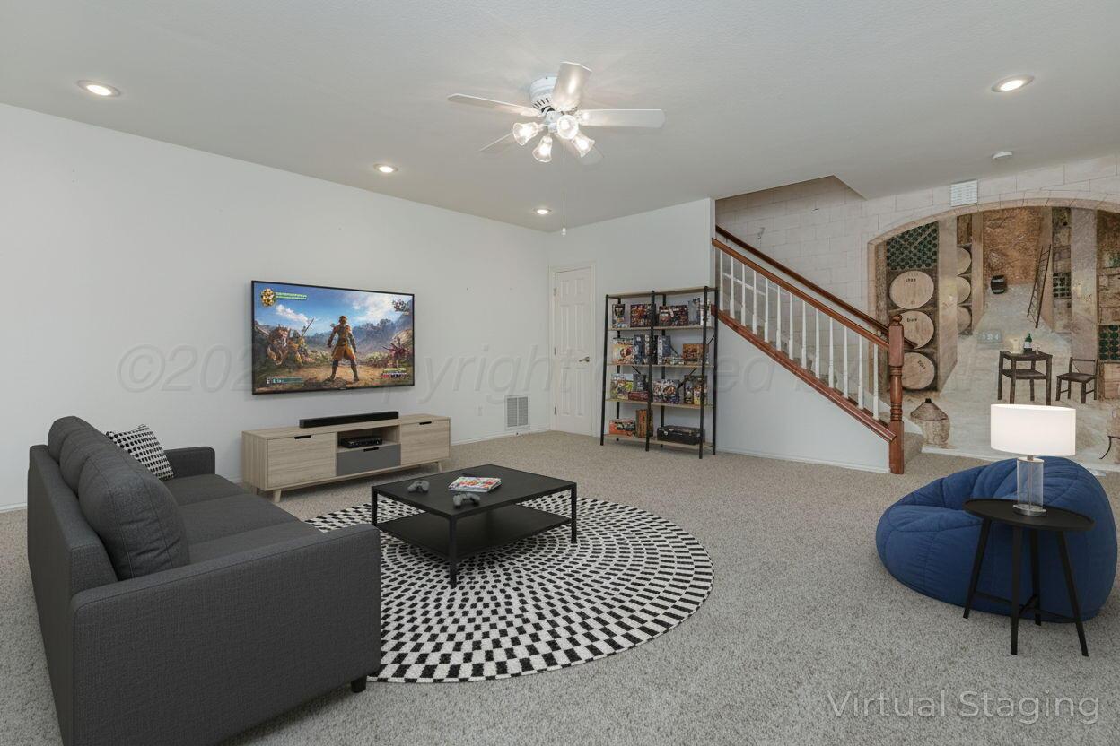 7408 Park Ridge Drive Amarillo, TX 79119 - Photo 42 of 51 a living room with furniture and a ceiling fan