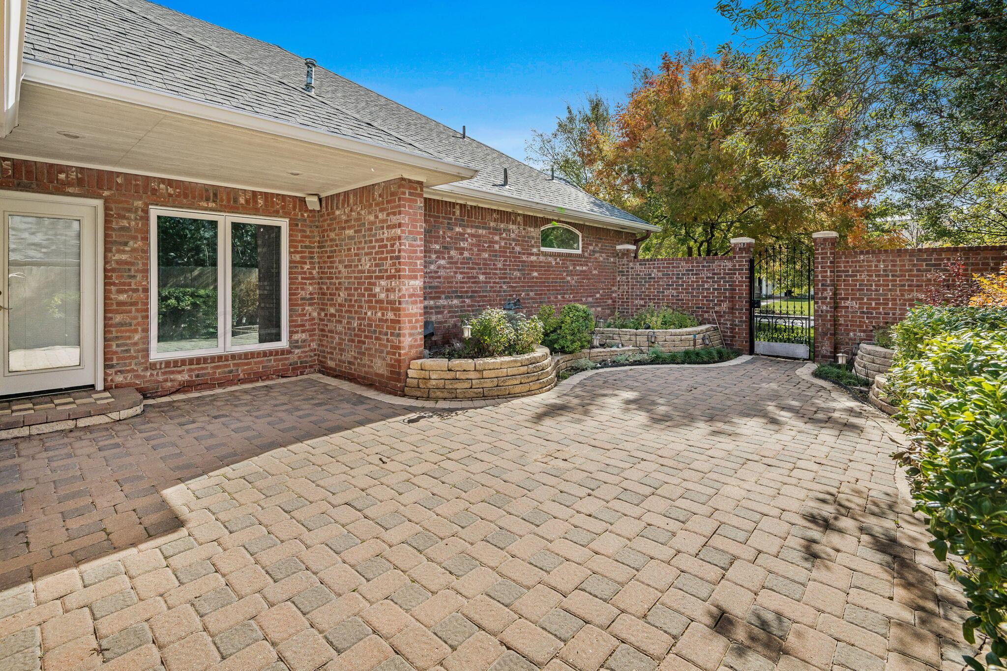 7408 Park Ridge Drive Amarillo, TX 79119 - Photo 46 of 51 a front view of a house with garden