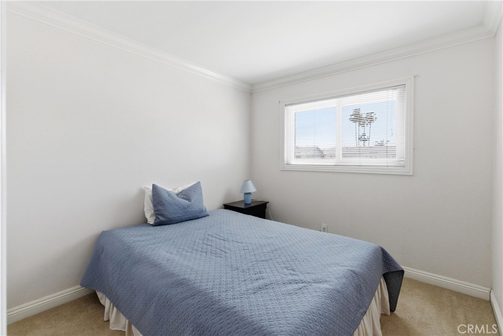 3342 Bradbury Road, Unit 20 Los Alamitos, CA 90720 - Photo 23 of 32 a bedroom with a bed and a window
