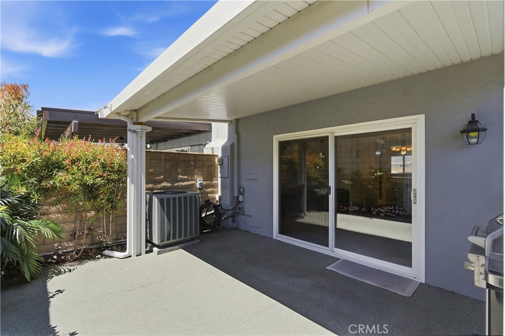 3342 Bradbury Road, Unit 20 Los Alamitos, CA 90720 - Photo 26 of 32 a balcony with a couch and table
