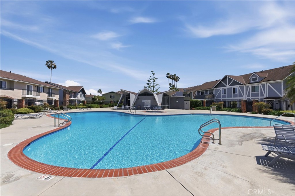 3342 Bradbury Road, Unit 20 Los Alamitos, CA 90720 - Photo 30 of 32 a view of a swimming pool with outdoor seating