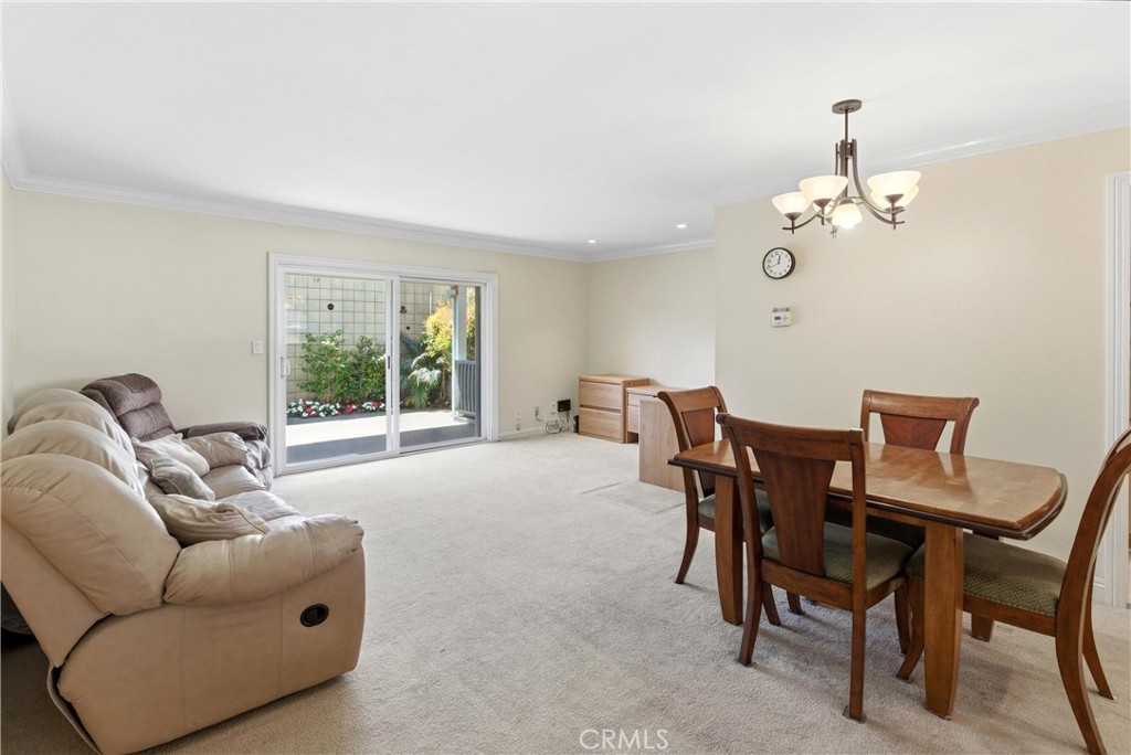 3342 Bradbury Road, Unit 20 Los Alamitos, CA 90720 - Photo 4 of 32 a living room with furniture and a window