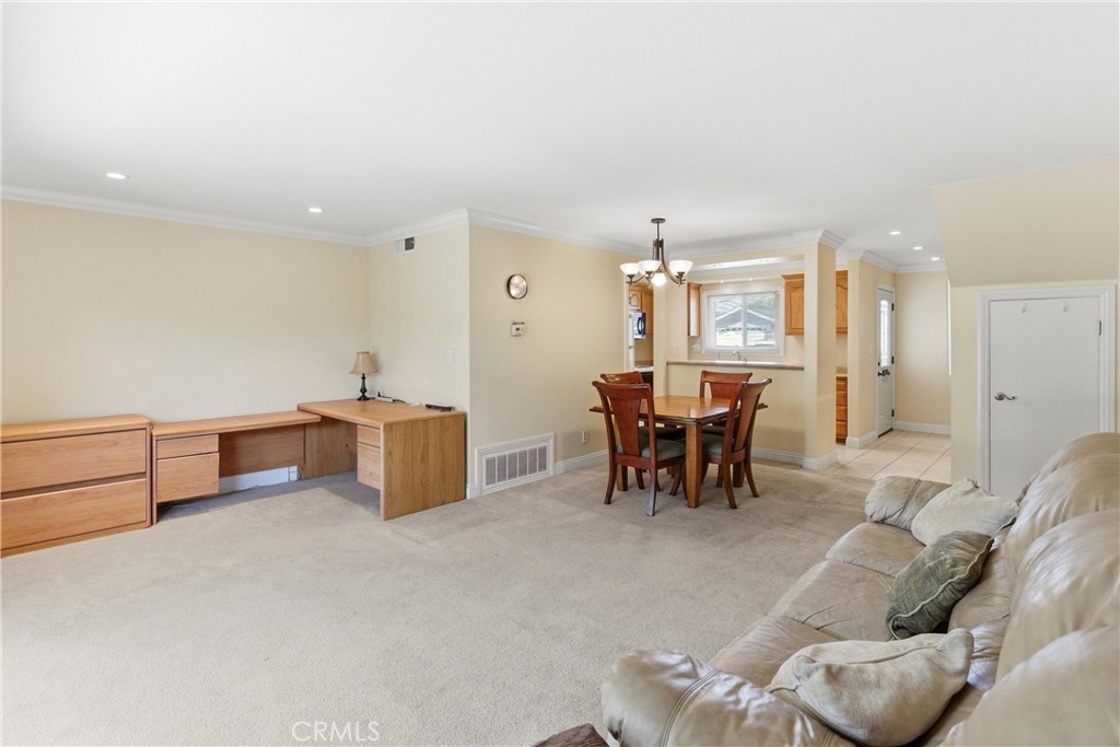 3342 Bradbury Road, Unit 20 Los Alamitos, CA 90720 - Photo 5 of 32 a living room with furniture and a table