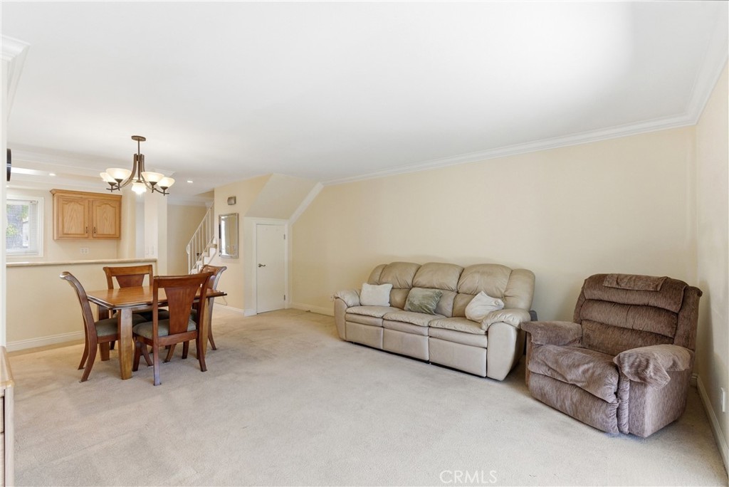 3342 Bradbury Road, Unit 20 Los Alamitos, CA 90720 - Photo 6 of 32 a living room with furniture and a dining table