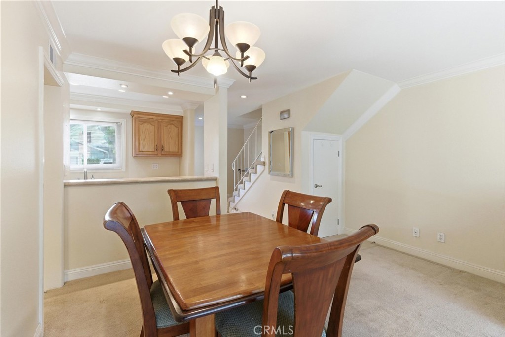 3342 Bradbury Road, Unit 20 Los Alamitos, CA 90720 - Photo 7 of 32 a dining room with furniture and window