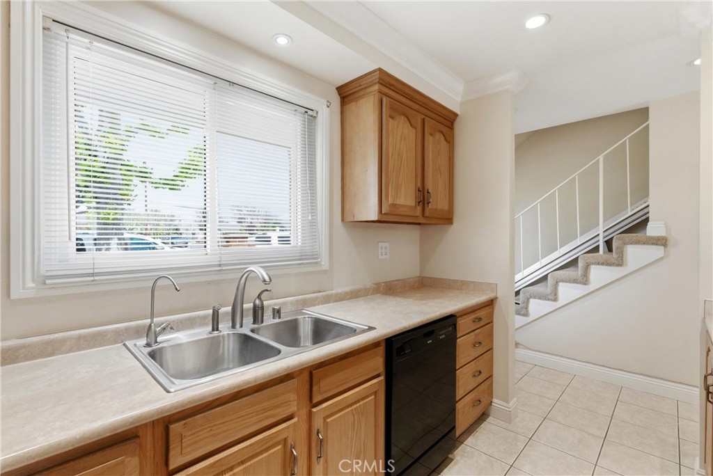 3342 Bradbury Road, Unit 20 Los Alamitos, CA 90720 - Photo 8 of 32 a kitchen with a sink and cabinets