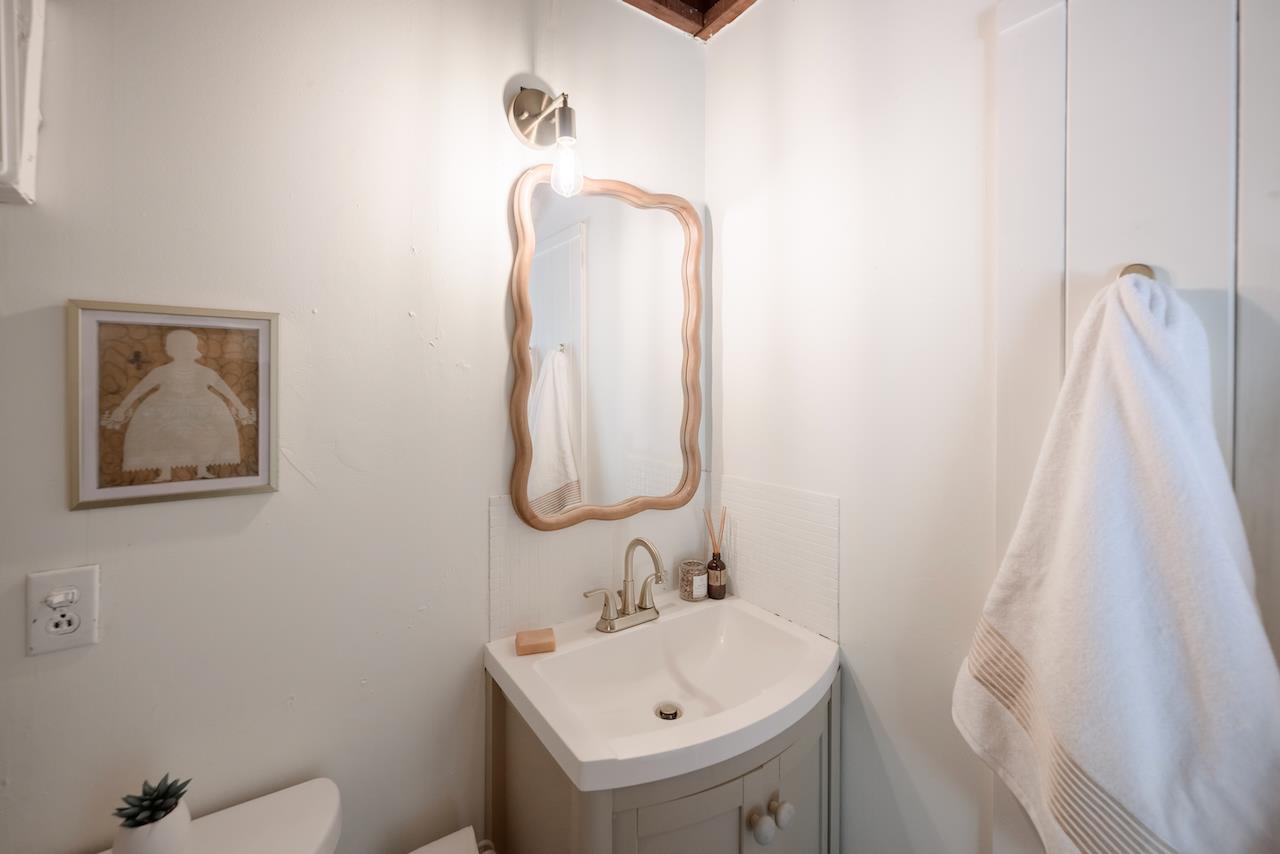 10735 Westwood Road Felton, CA 95018 - Photo 101 of 118 a bathroom with a sink and mirror with toilet