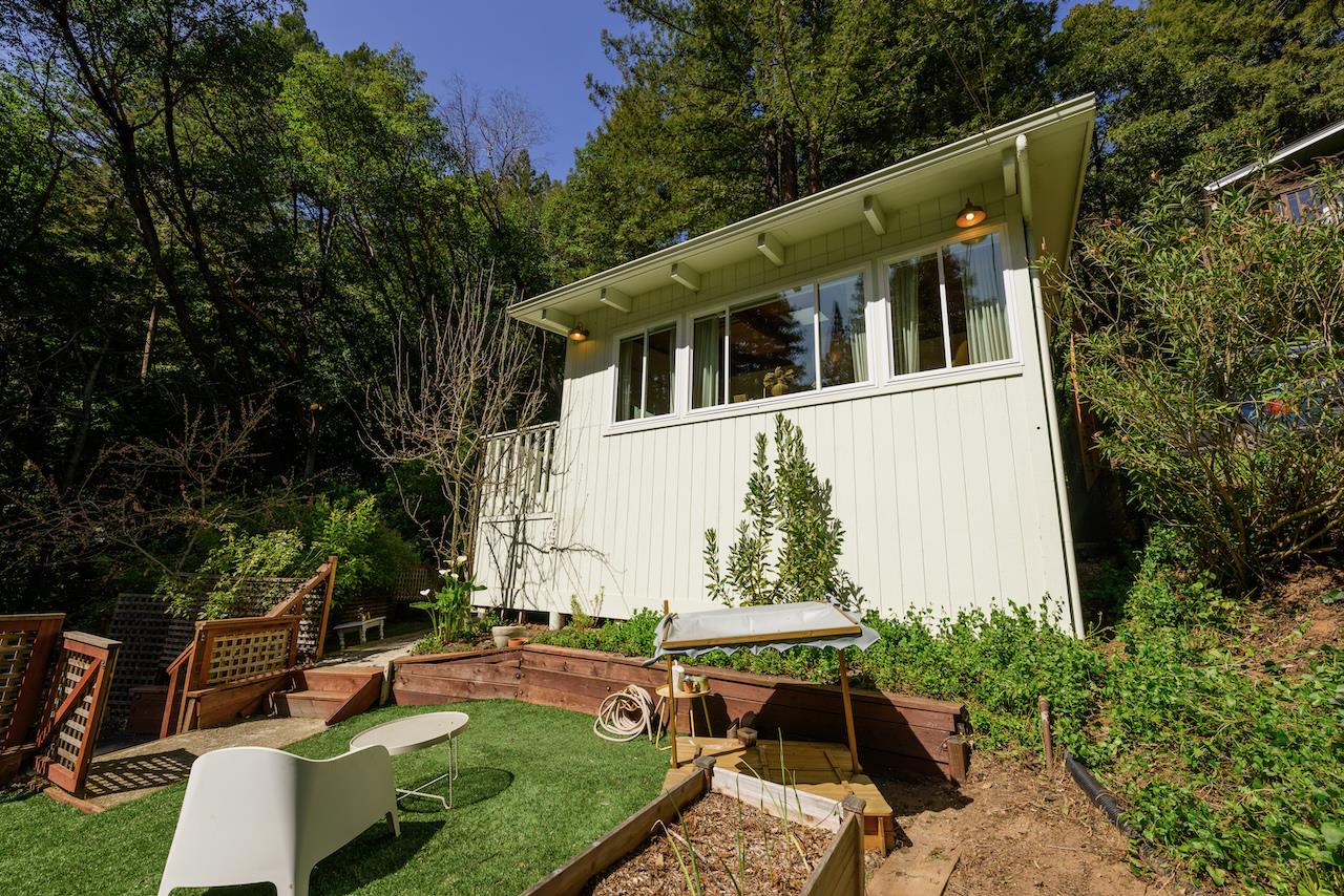 10735 Westwood Road Felton, CA 95018 - Photo 12 of 118 a view of a patio with table and chairs potted plants and large tree