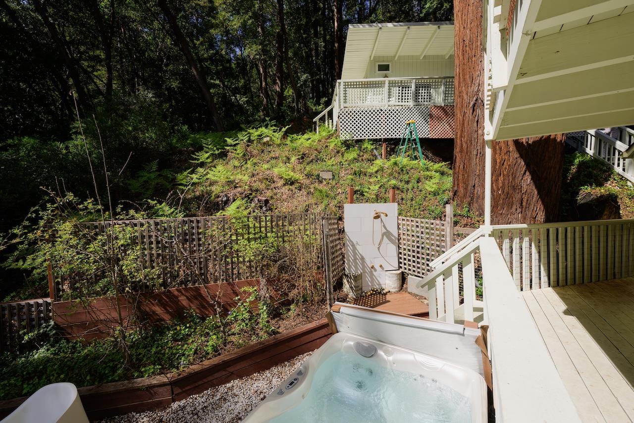 10735 Westwood Road Felton, CA 95018 - Photo 17 of 118 a view of a house with a yard and potted plants