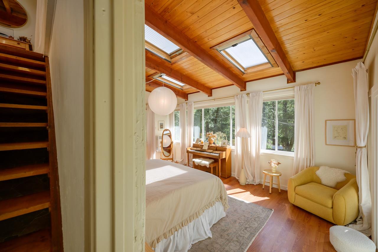 10735 Westwood Road Felton, CA 95018 - Photo 22 of 118 a bedroom with furniture and a large window