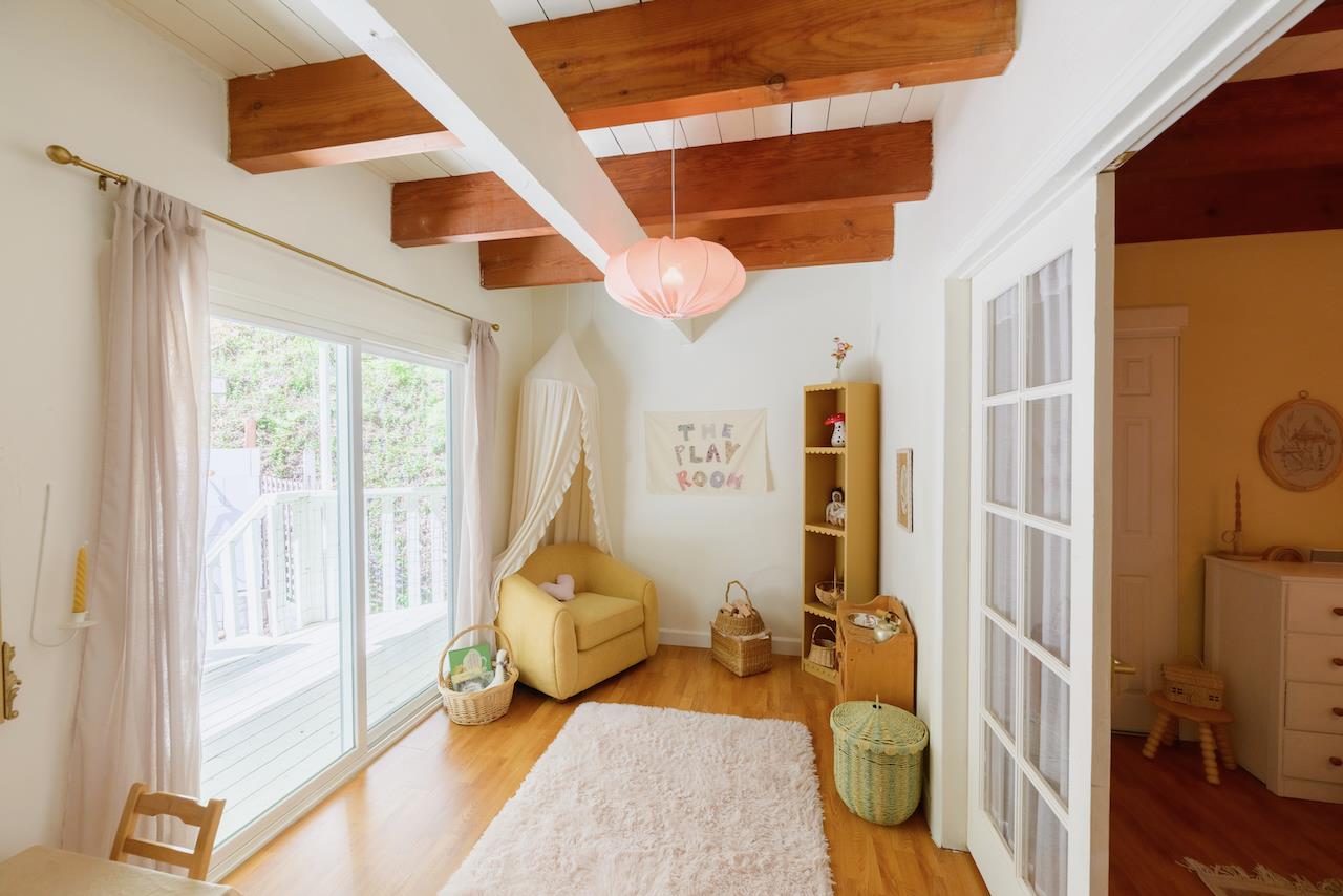 10735 Westwood Road Felton, CA 95018 - Photo 32 of 118 a living room with furniture and a floor to ceiling window