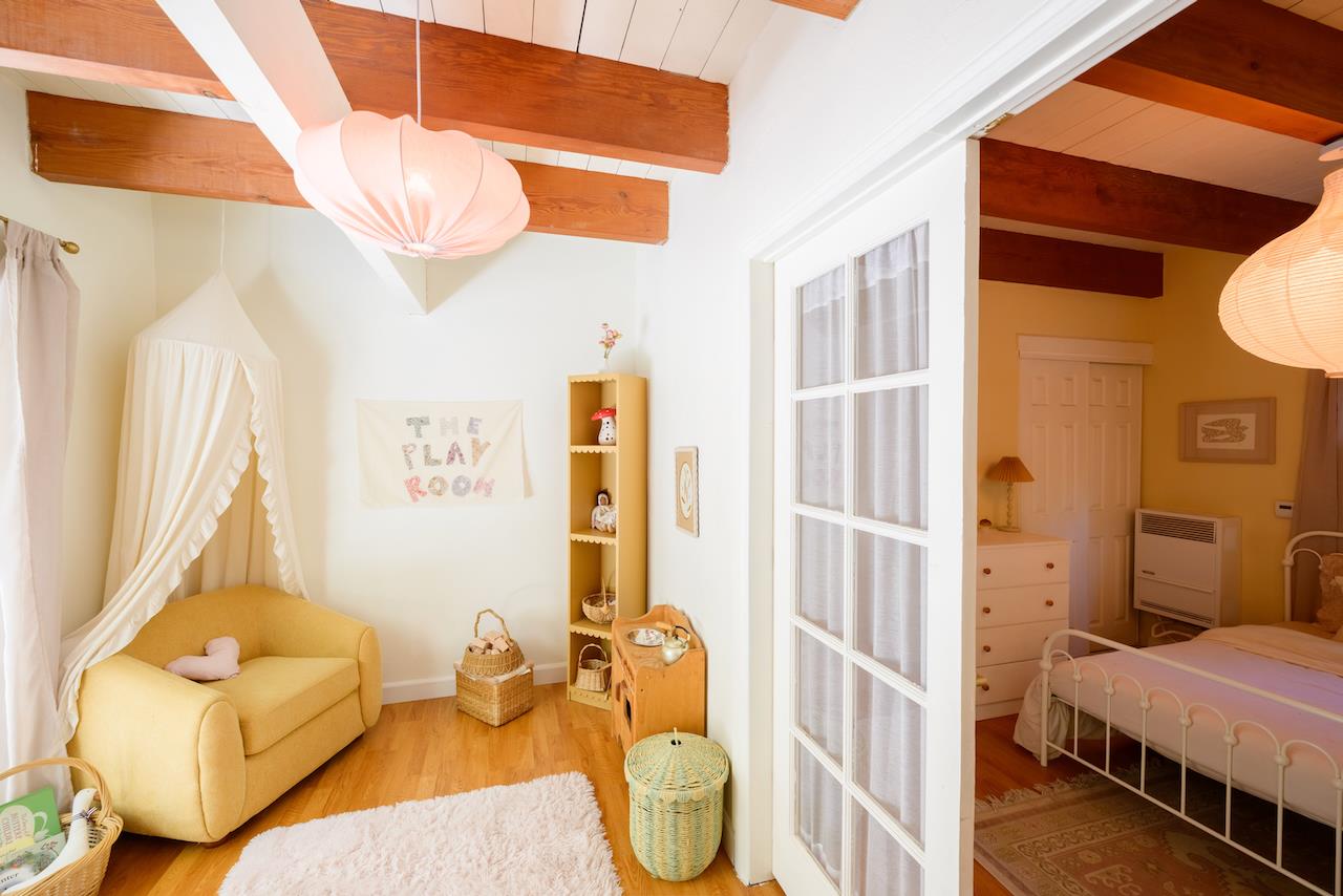 10735 Westwood Road Felton, CA 95018 - Photo 33 of 118 a bedroom with a bed and wooden floor