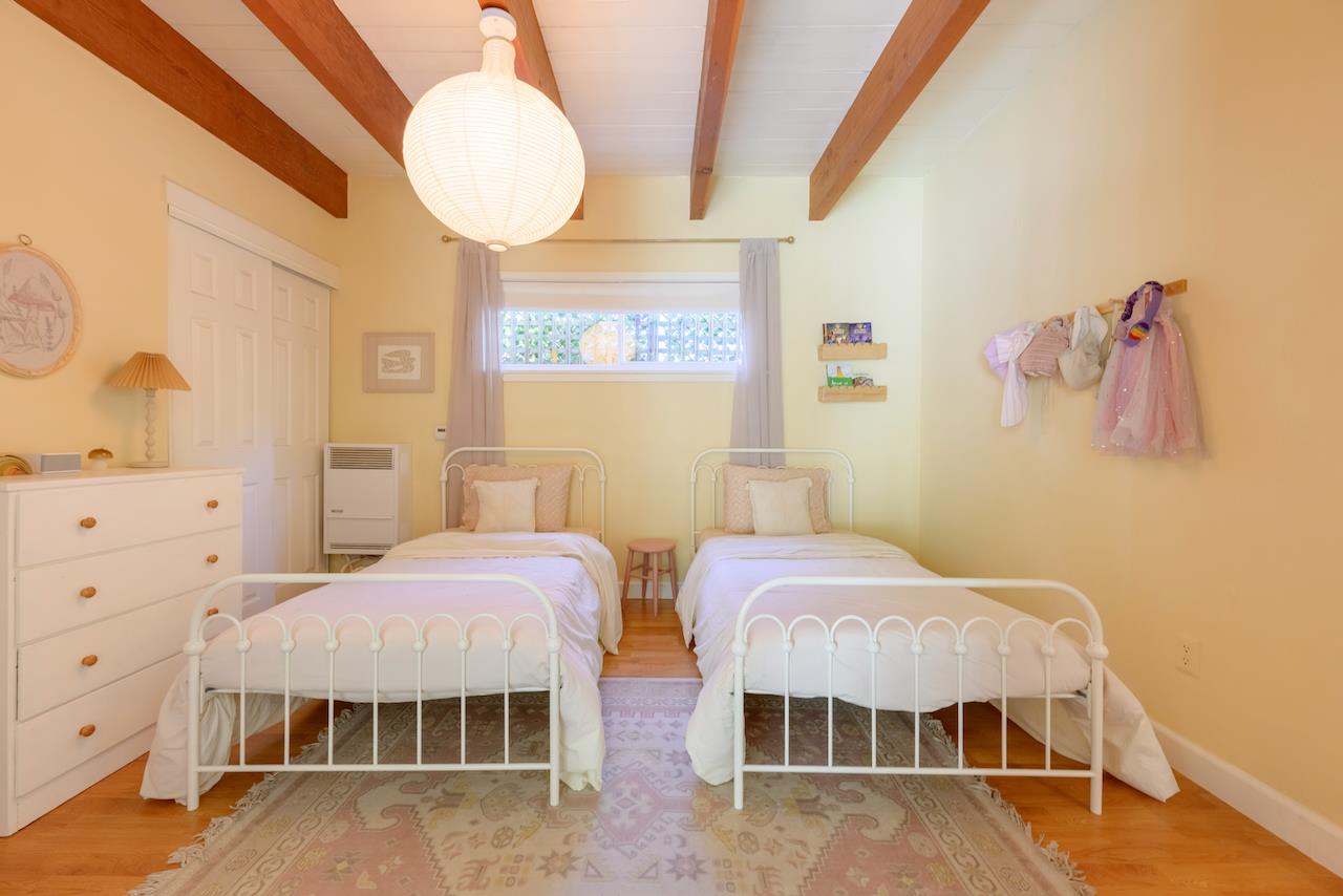 10735 Westwood Road Felton, CA 95018 - Photo 36 of 118 a bedroom with two beds and painting on the wall