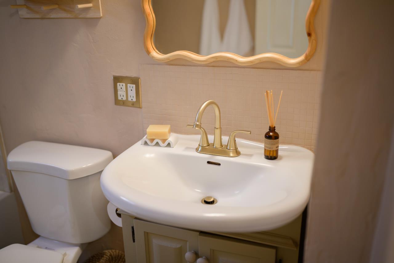 10735 Westwood Road Felton, CA 95018 - Photo 42 of 118 a bathroom with a sink a toilet and a mirror