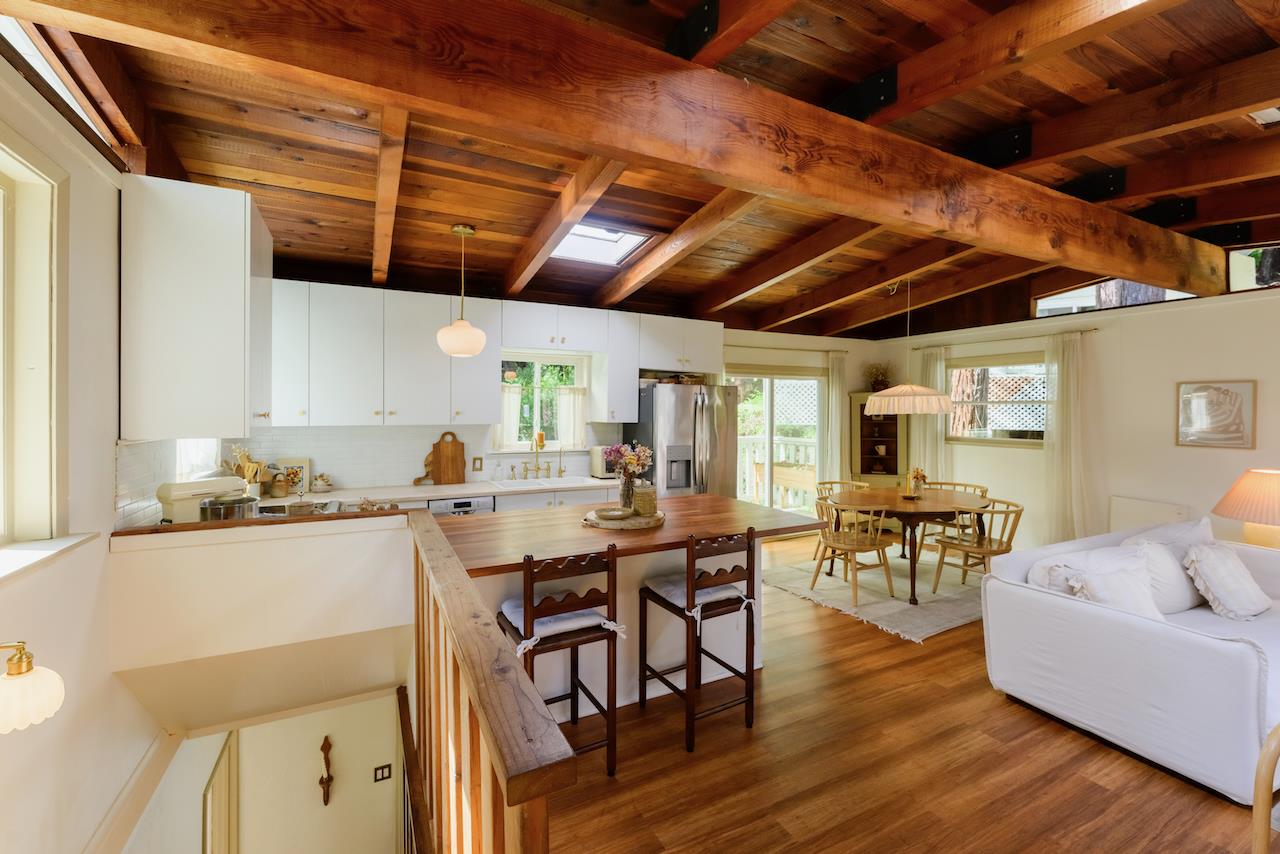 10735 Westwood Road Felton, CA 95018 - Photo 58 of 118 a kitchen with stainless steel appliances granite countertop a stove top oven a dining table and chairs with wooden floor