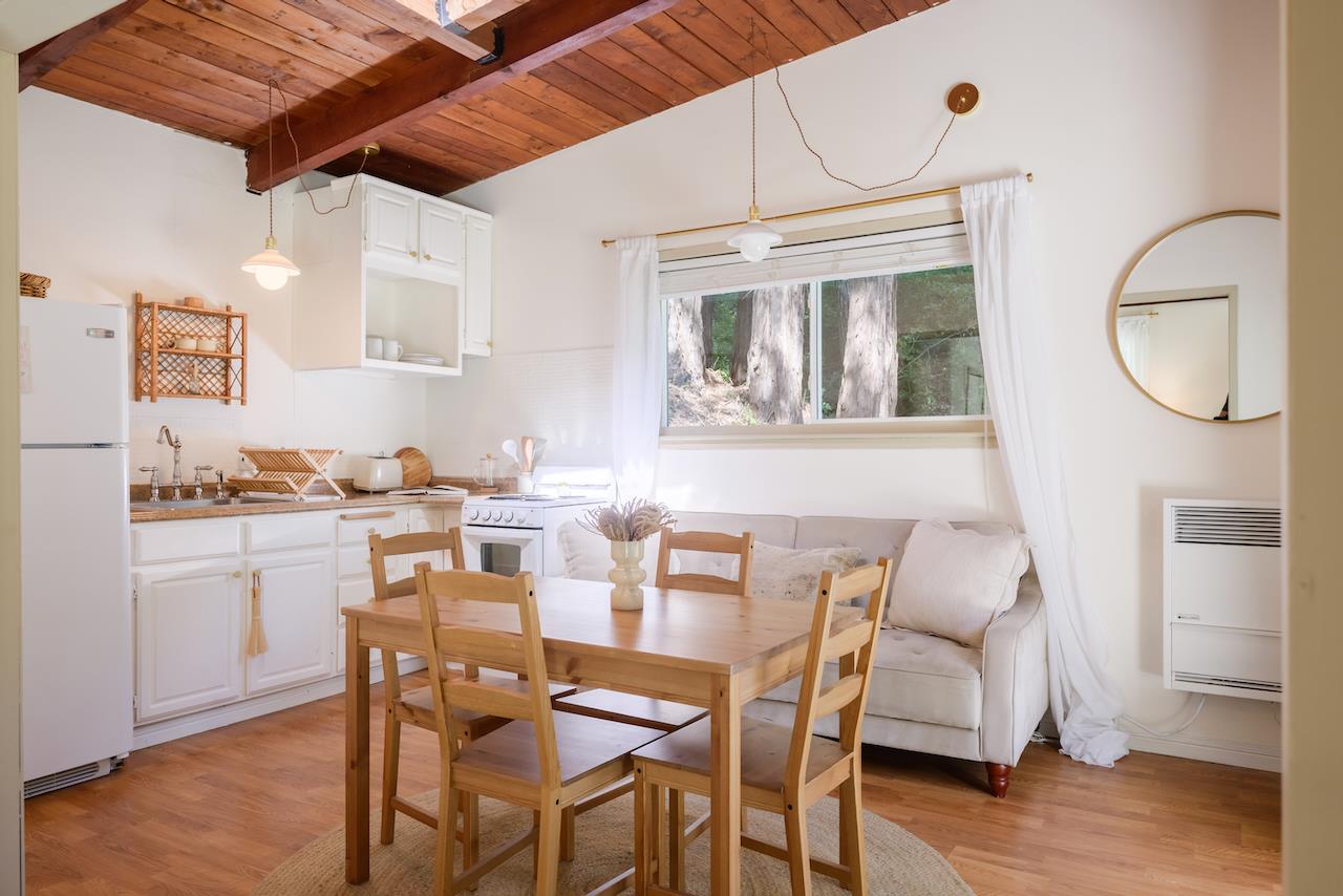 10735 Westwood Road Felton, CA 95018 - Photo 98 of 118 a dining room with wooden floor and a chandelier