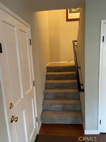 a view of staircase with white walls