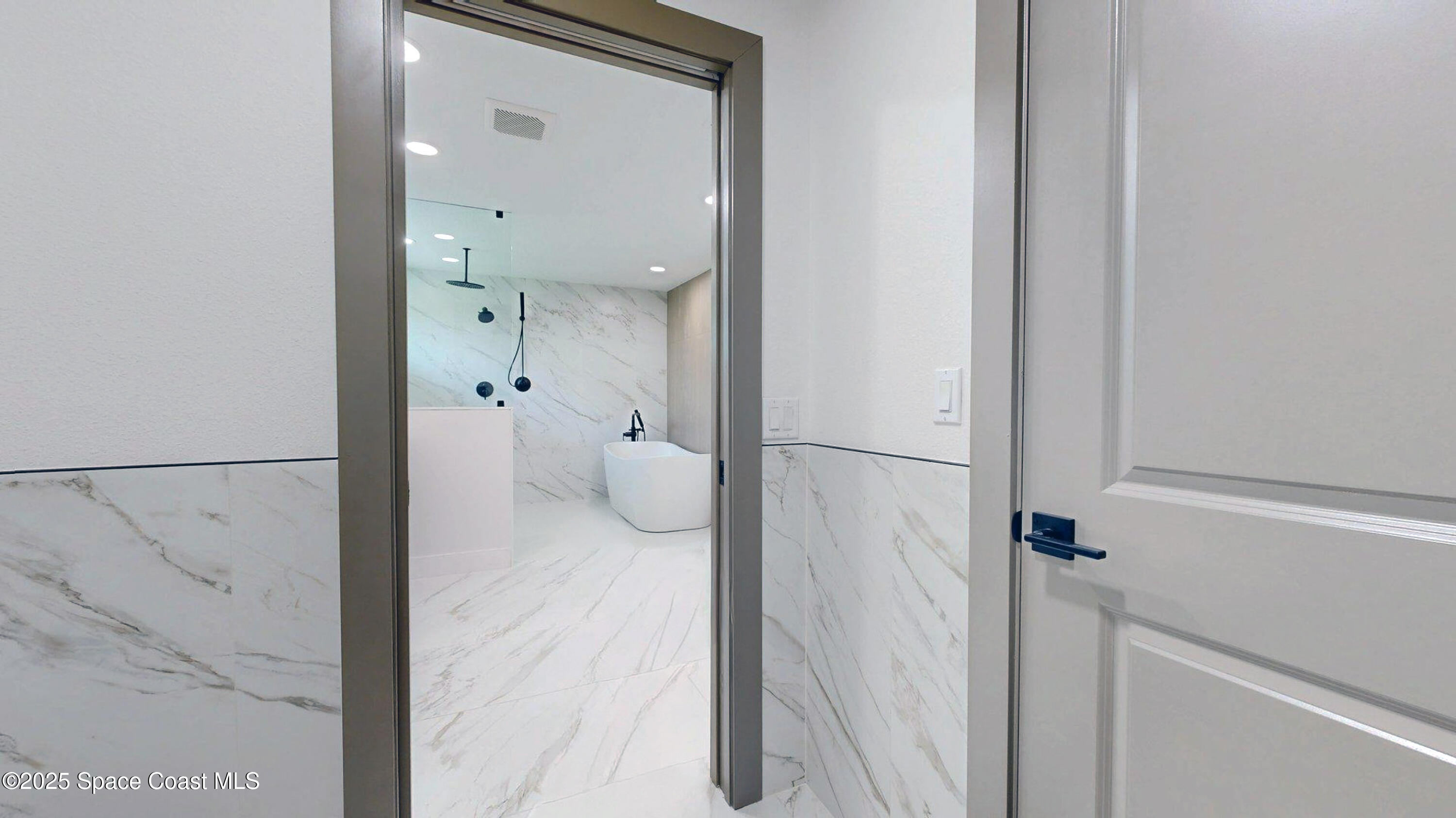 855 Cliftons Cove Court Cocoa, FL 32926 - Photo 42 of 72 a view of a bathroom from a hallway
