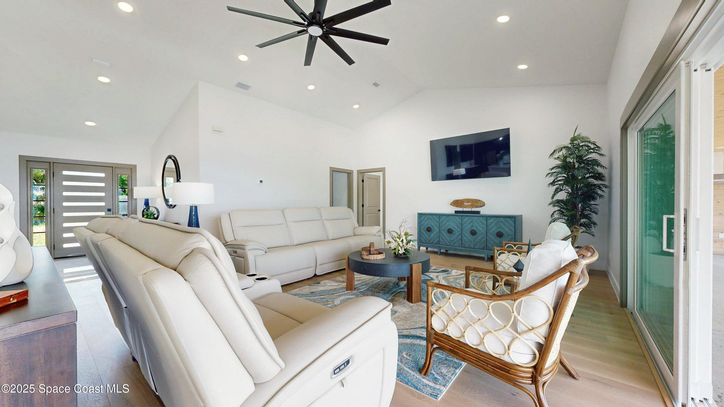 855 Cliftons Cove Court Cocoa, FL 32926 - Photo 45 of 72 a living room with furniture and a flat screen tv