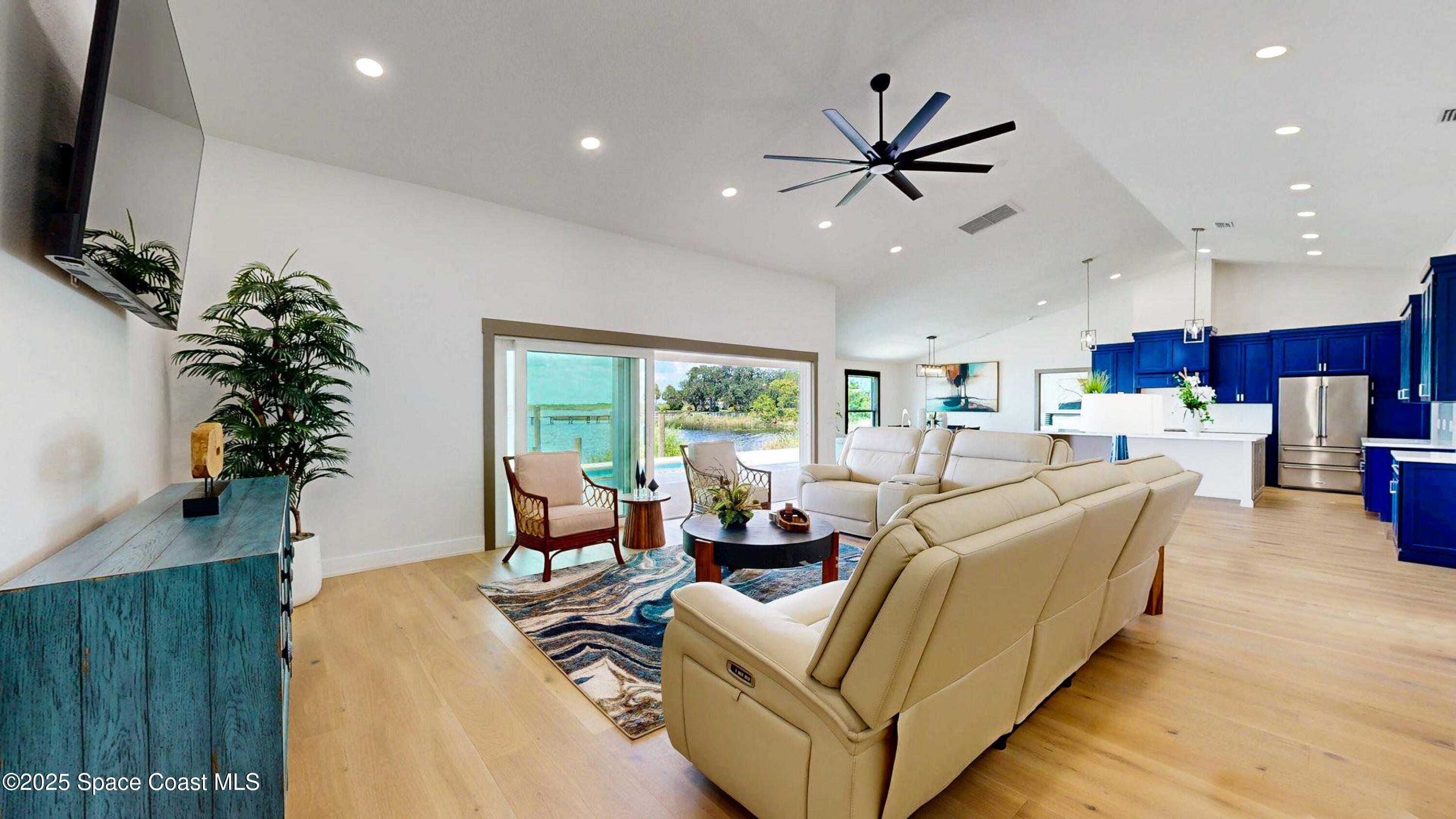 855 Cliftons Cove Court Cocoa, FL 32926 - Photo 48 of 72 a living room with furniture kitchen view and a large window