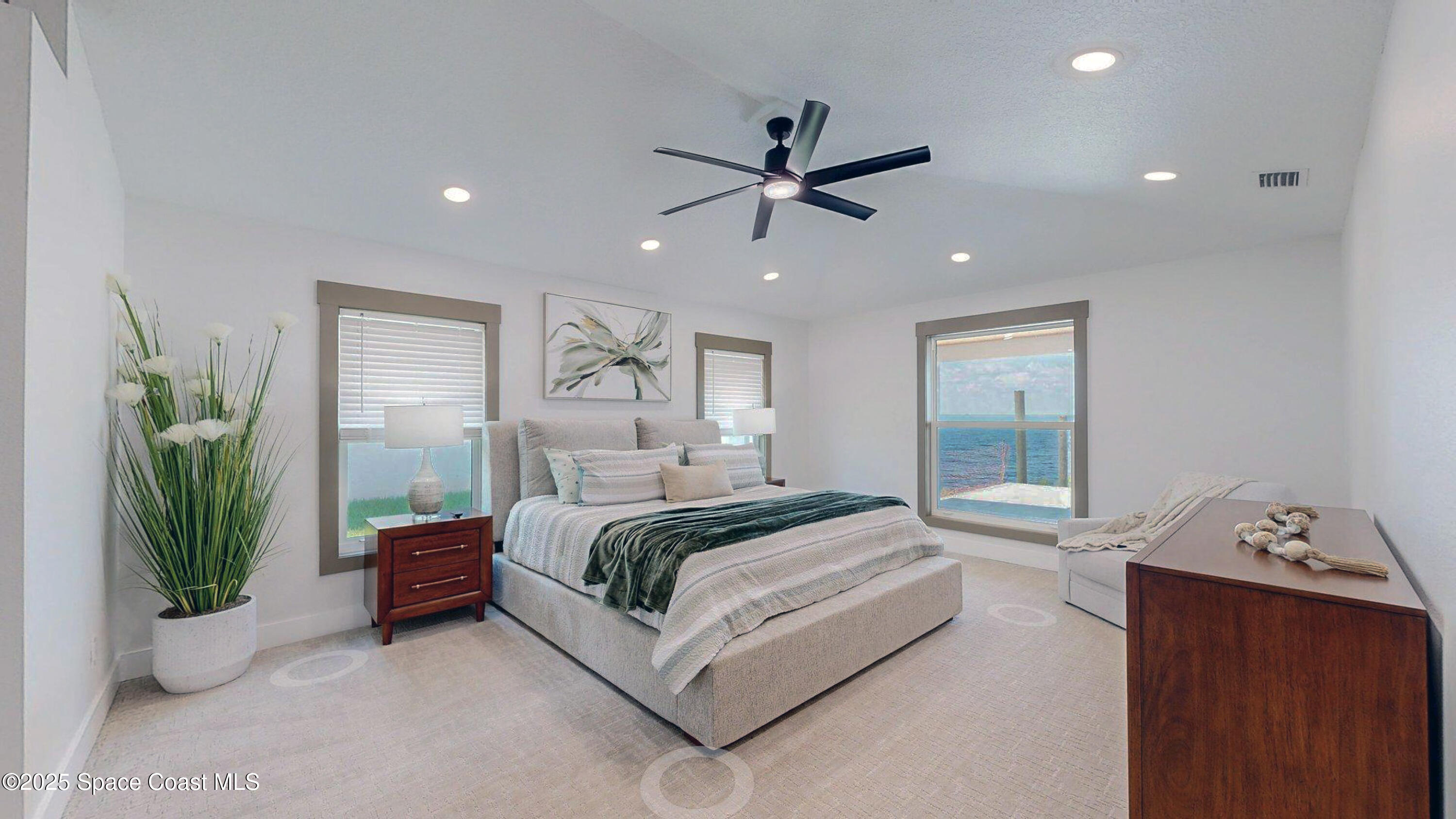 855 Cliftons Cove Court Cocoa, FL 32926 - Photo 49 of 72 a spacious bedroom with a bed and ceiling fan