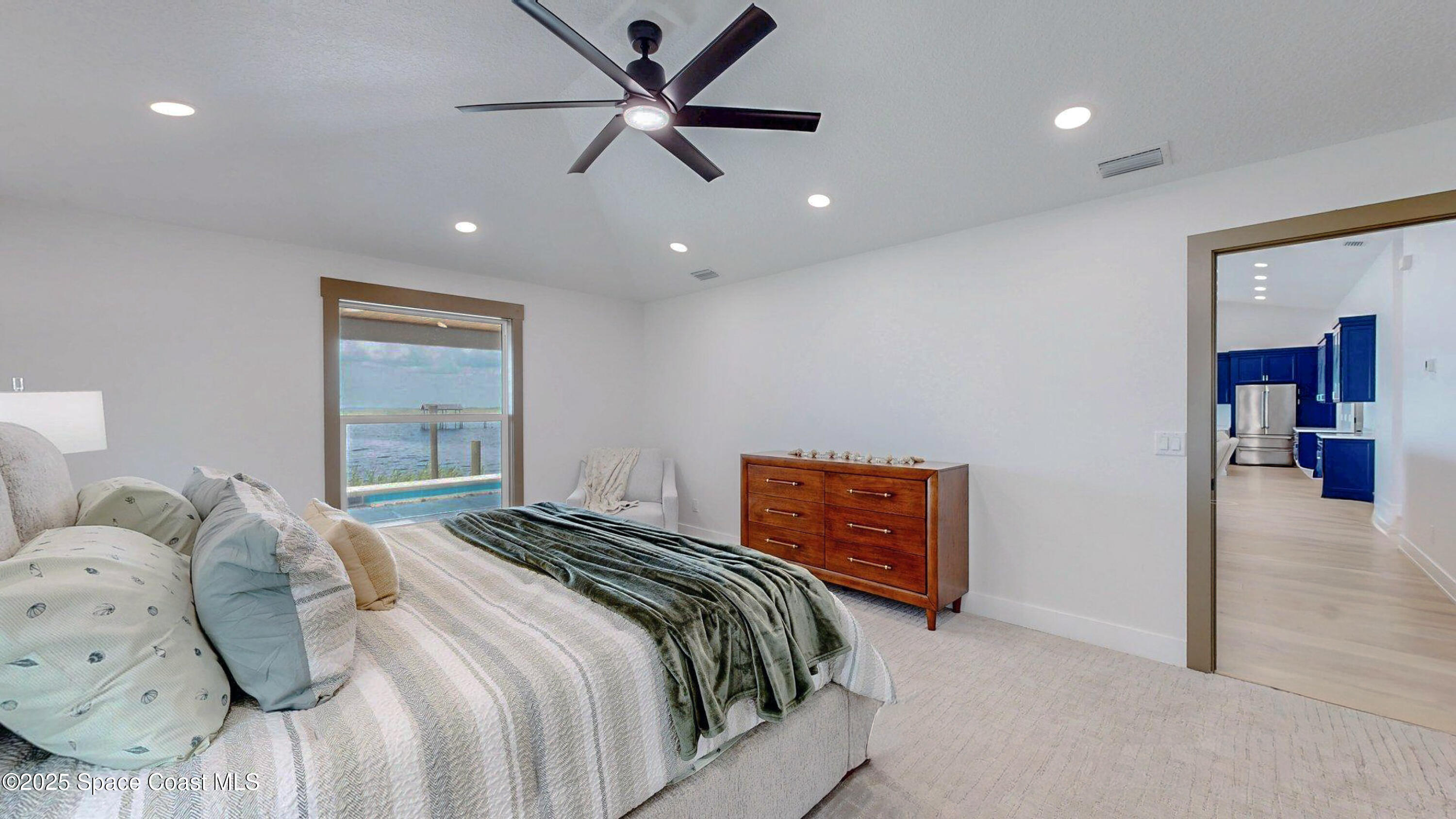 855 Cliftons Cove Court Cocoa, FL 32926 - Photo 51 of 72 a bedroom with a bed and a ceiling fan