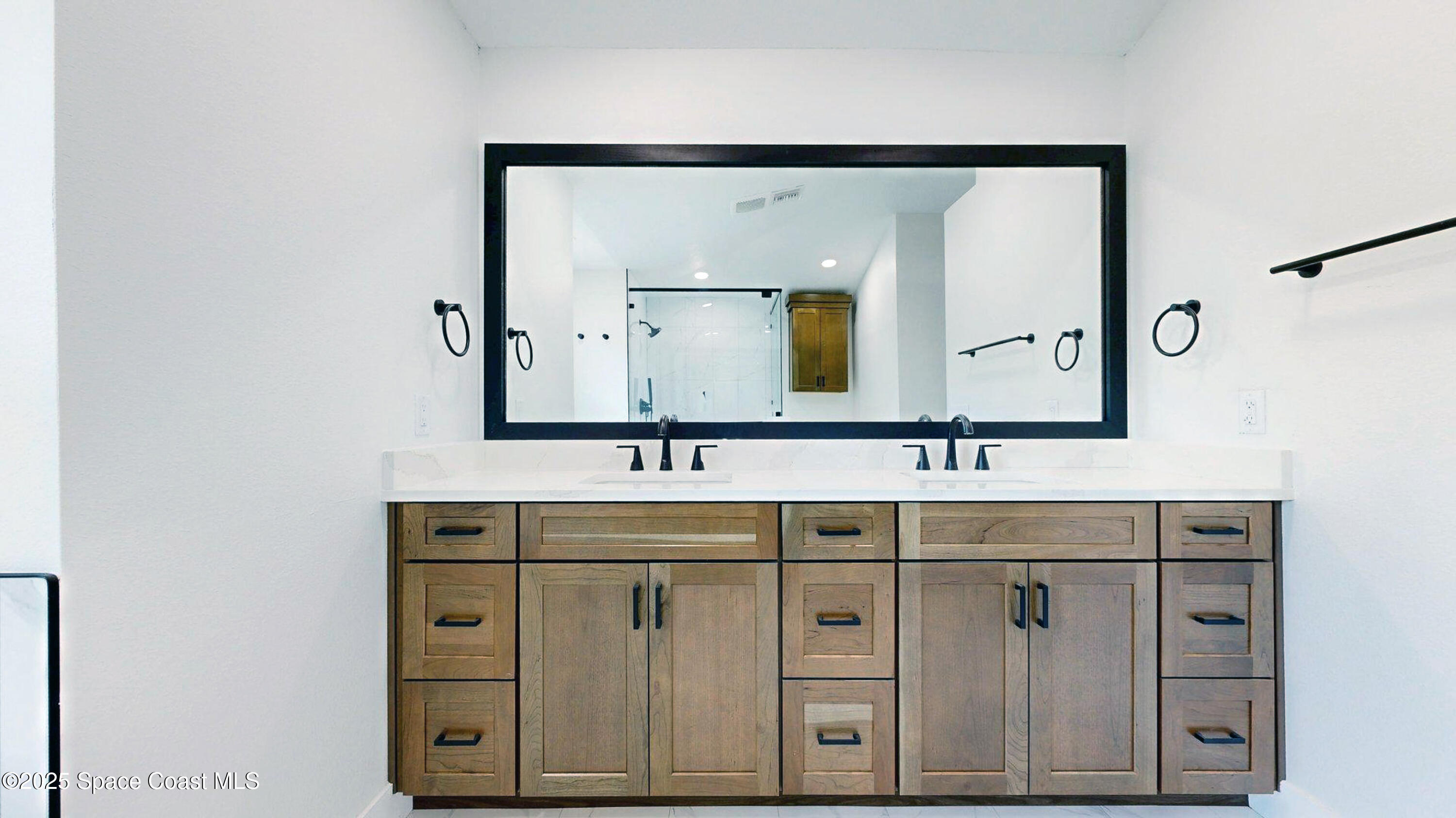 855 Cliftons Cove Court Cocoa, FL 32926 - Photo 54 of 72 a bathroom with a double vanity sink and mirror