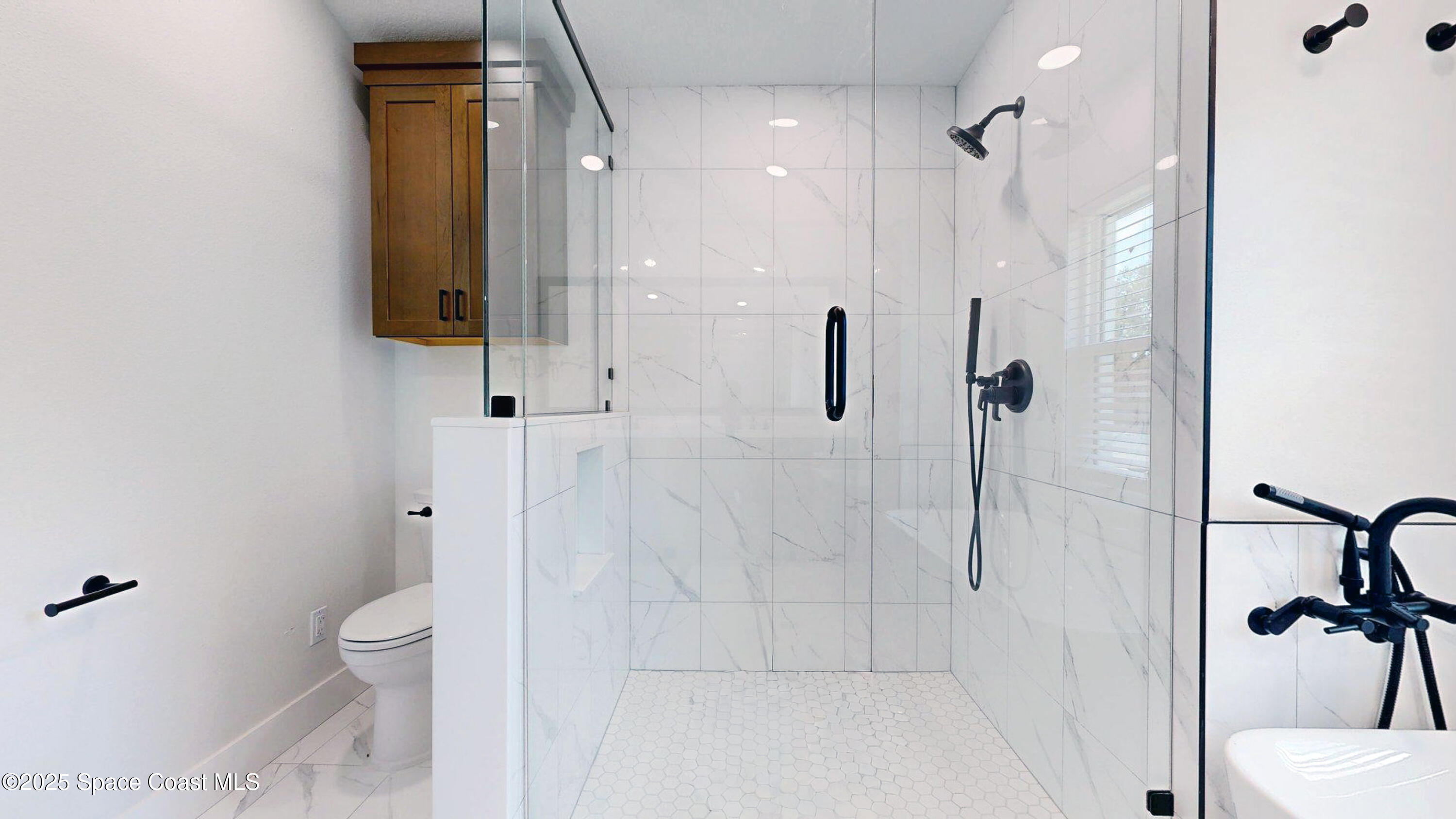 855 Cliftons Cove Court Cocoa, FL 32926 - Photo 55 of 72 a bathroom with a granite countertop shower a toilet and a sink