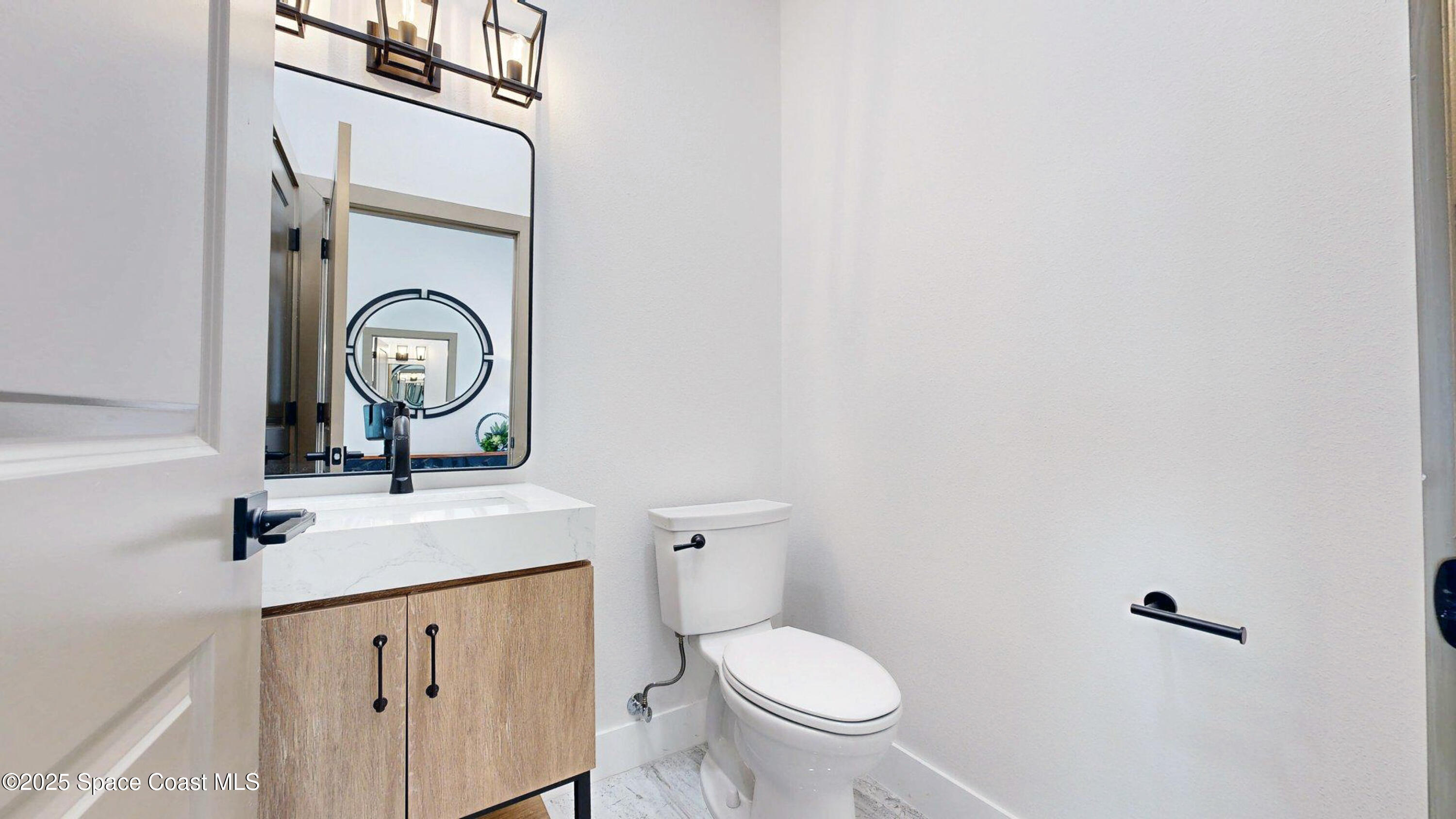 855 Cliftons Cove Court Cocoa, FL 32926 - Photo 65 of 72 a bathroom with a toilet and a sink