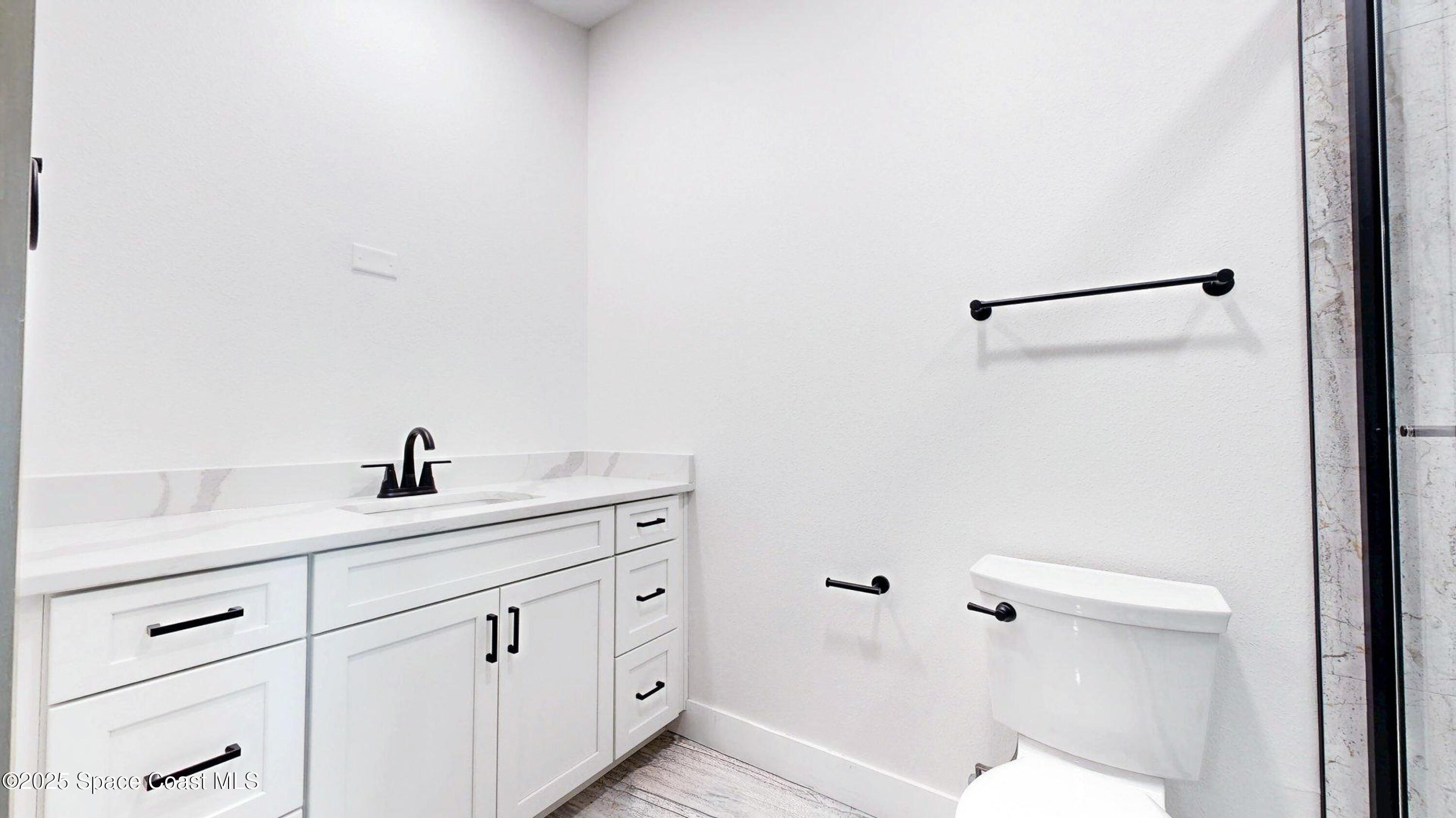 855 Cliftons Cove Court Cocoa, FL 32926 - Photo 69 of 72 a bathroom with a granite countertop sink and a mirror