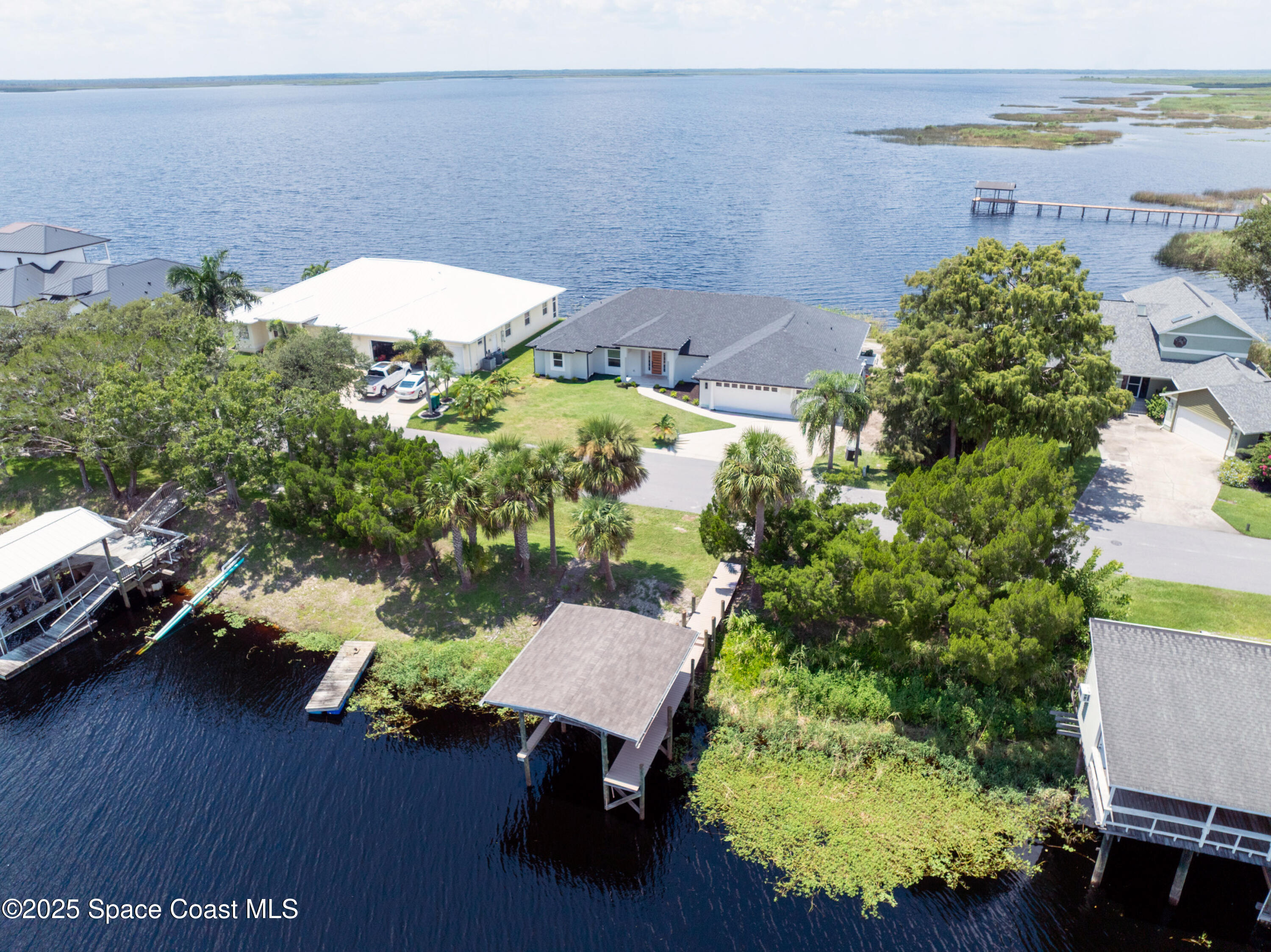 855 Cliftons Cove Court Cocoa, FL 32926 - Photo 7 of 72 an aerial view of a house with a yard basket ball court and a yard