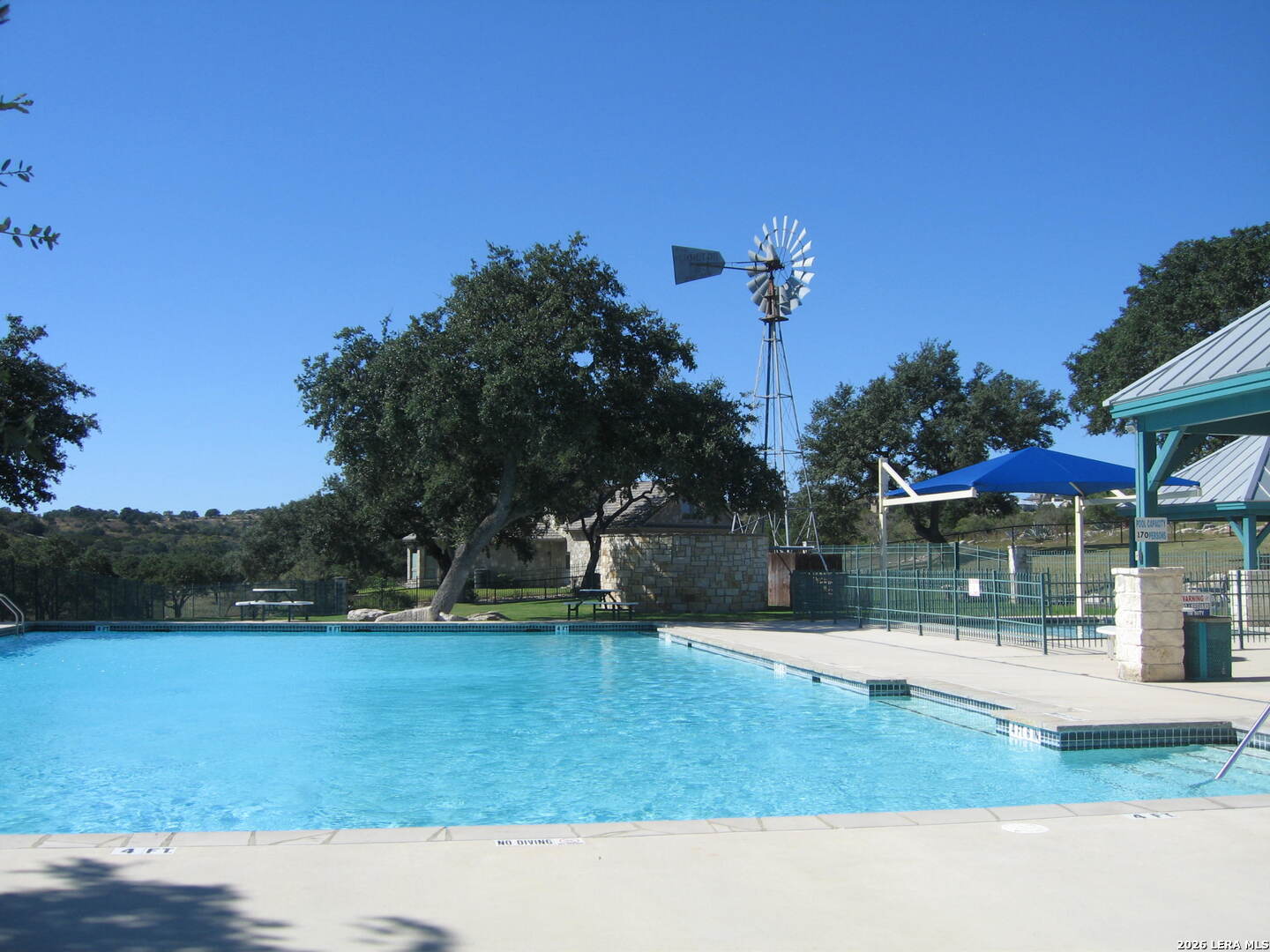 323 Toucan Drive Spring Branch, TX 78070 - Photo 3 of 13 a backyard of a house with table and chairs