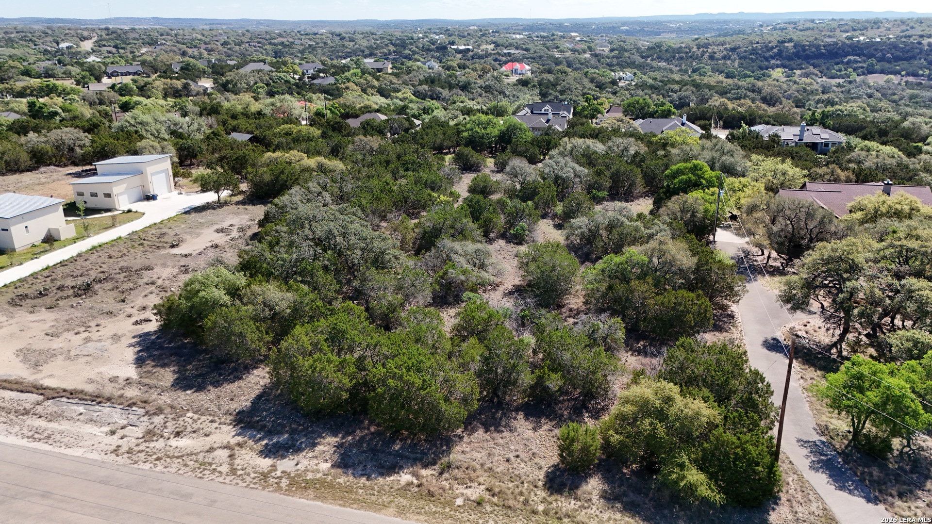 323 Toucan Drive Spring Branch, TX 78070 - Photo 5 of 13 an aerial view of a house with a yard