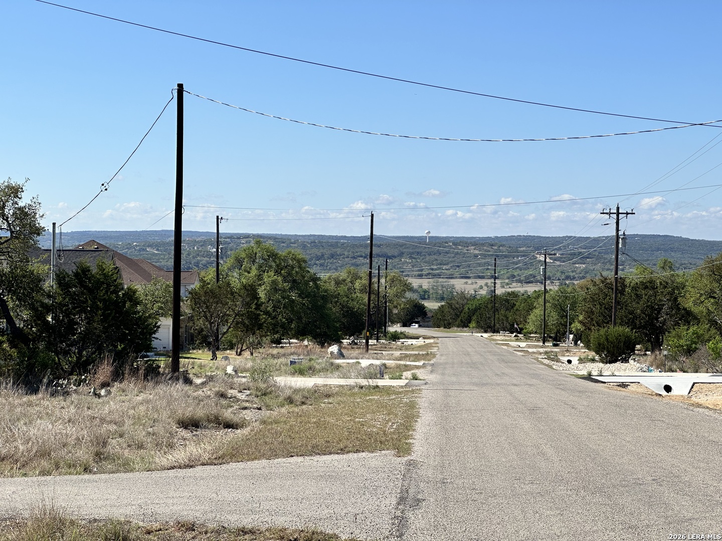 323 Toucan Drive Spring Branch, TX 78070 - Photo 8 of 13 a view of a road with a bench in the background