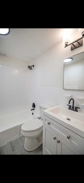 103 South Policy Street, Unit 4 Salem, NH 03079 - Photo 3 of 4 a bathroom with a sink and a toilet