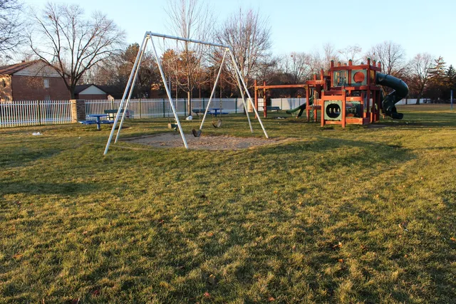 a view of a park with swings