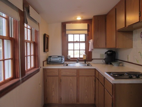 3 Brooks Road Rockport, MA 01966 - Photo 11 of 26 a kitchen with stainless steel appliances granite countertop a sink stove and refrigerator