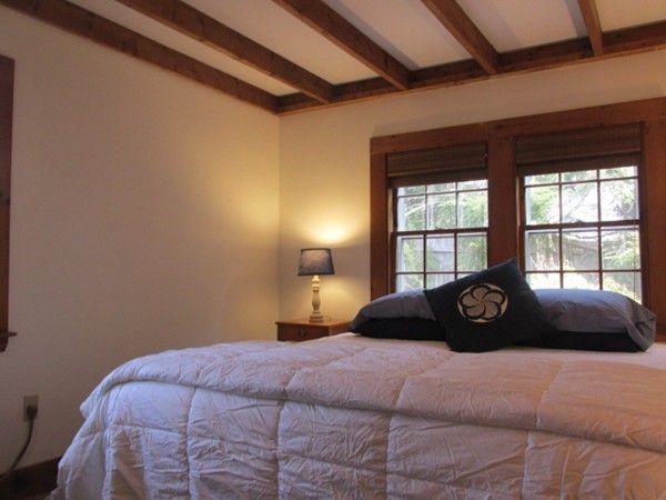 3 Brooks Road Rockport, MA 01966 - Photo 15 of 26 a bedroom with a bed window and a chair