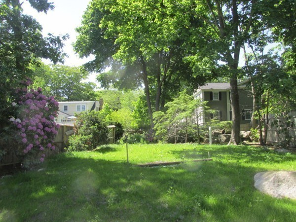 3 Brooks Road Rockport, MA 01966 - Photo 17 of 26 a view of a backyard with a garden