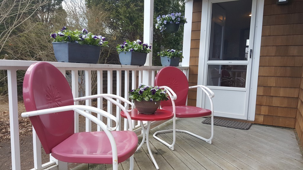 3 Brooks Road Rockport, MA 01966 - Photo 20 of 26 a view of a chair and table in the backyard