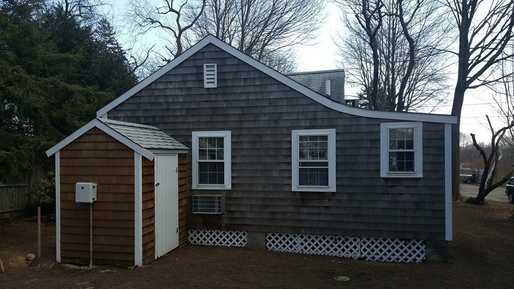 3 Brooks Road Rockport, MA 01966 - Photo 21 of 26 a front view of a house with a yard