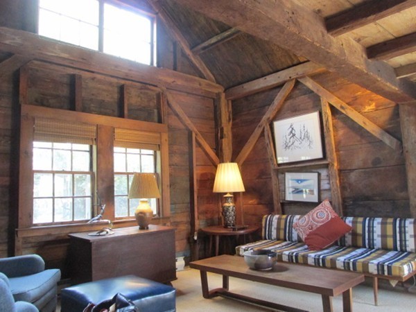 3 Brooks Road Rockport, MA 01966 - Photo 7 of 26 a living room with furniture a fireplace and large windows