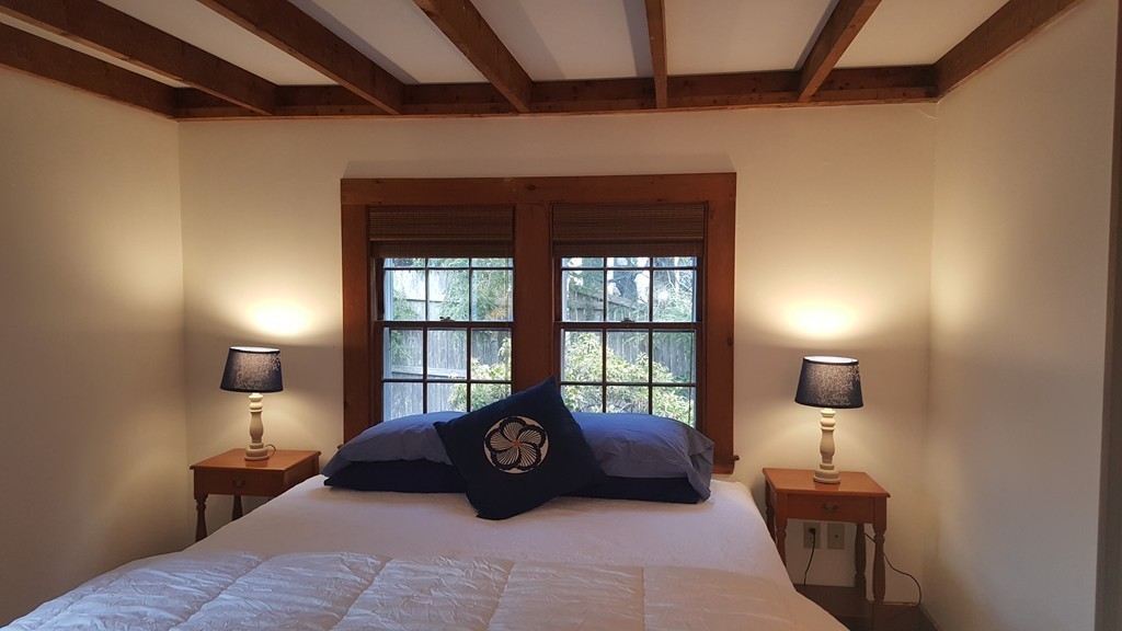 3 Brooks Road Rockport, MA 01966 - Photo 10 of 26 a bedroom with a bed and wooden floor