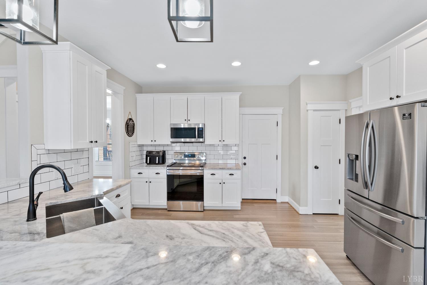 835 Sunset Ridge Drive Concord, VA 24538 - Photo 14 of 57 a kitchen with stainless steel appliances granite countertop a stove a sink and a refrigerator