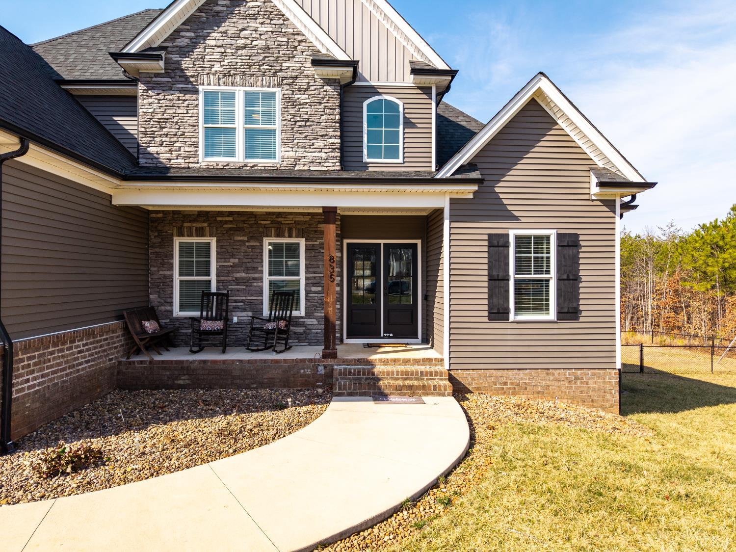 835 Sunset Ridge Drive Concord, VA 24538 - Photo 2 of 57 a front view of a house with a yard and porch